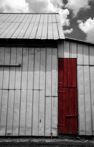 Red Wooden Door on a Tin Barn